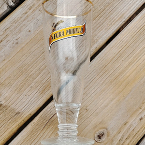 Negra Modelo Drinking Glass Gold Rim Upside Down